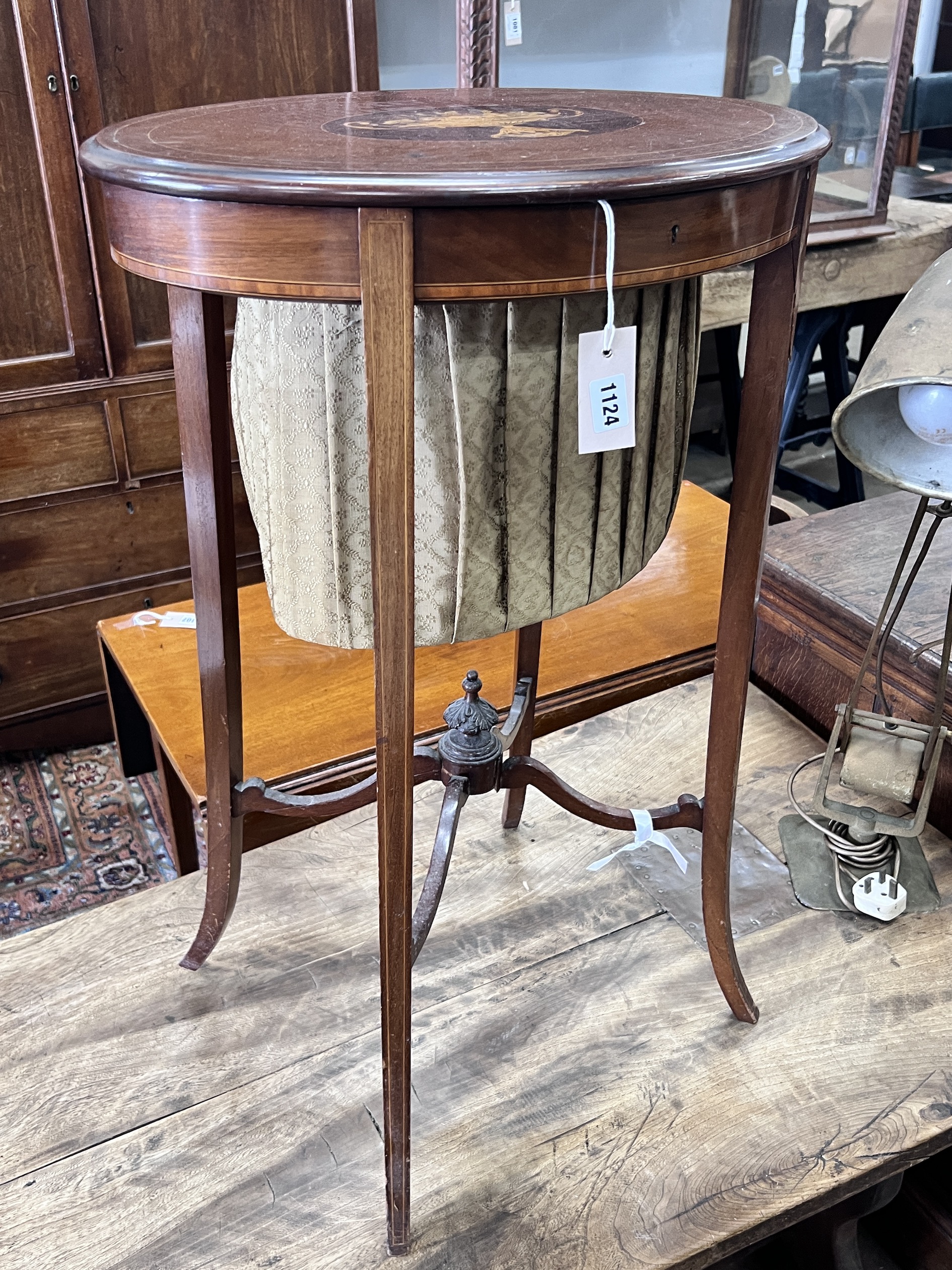 An Edwardian marquetry inlaid oval mahogany work table, width 52cm, depth 37cm, height 78cm